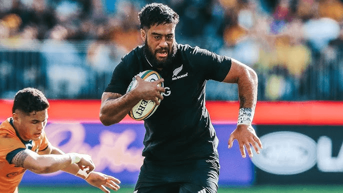 Akira Ioane running the ball for New Zealand in context of rugby switching nations rules