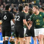 Springboks and All Blacks players shake hands on the pitch after the final whistle of a Test match