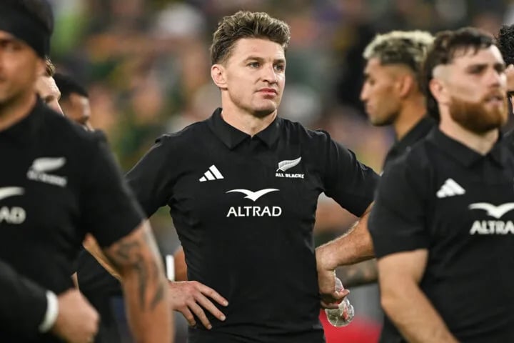 Beauden Barrett, hands on hips, among All Blacks players after a defeat to the Springboks