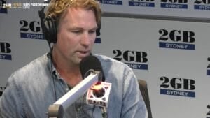 Rocky Elsom, former Wallabies captain, speaking into a 2GB microphone on Ben Fordham Live in Sydney about his French conviction and arrest warrant