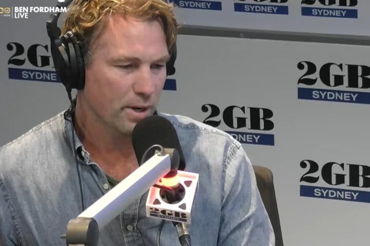 Rocky Elsom, former Wallabies captain, speaking into a 2GB microphone on Ben Fordham Live in Sydney about his French conviction and arrest warrant