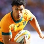 Wallabies player ratings: a Wallabies back in the gold jersey runs with the ball in both hands