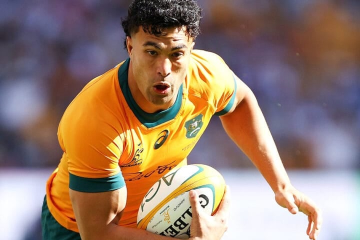 Wallabies player ratings: a Wallabies back in the gold jersey runs with the ball in both hands