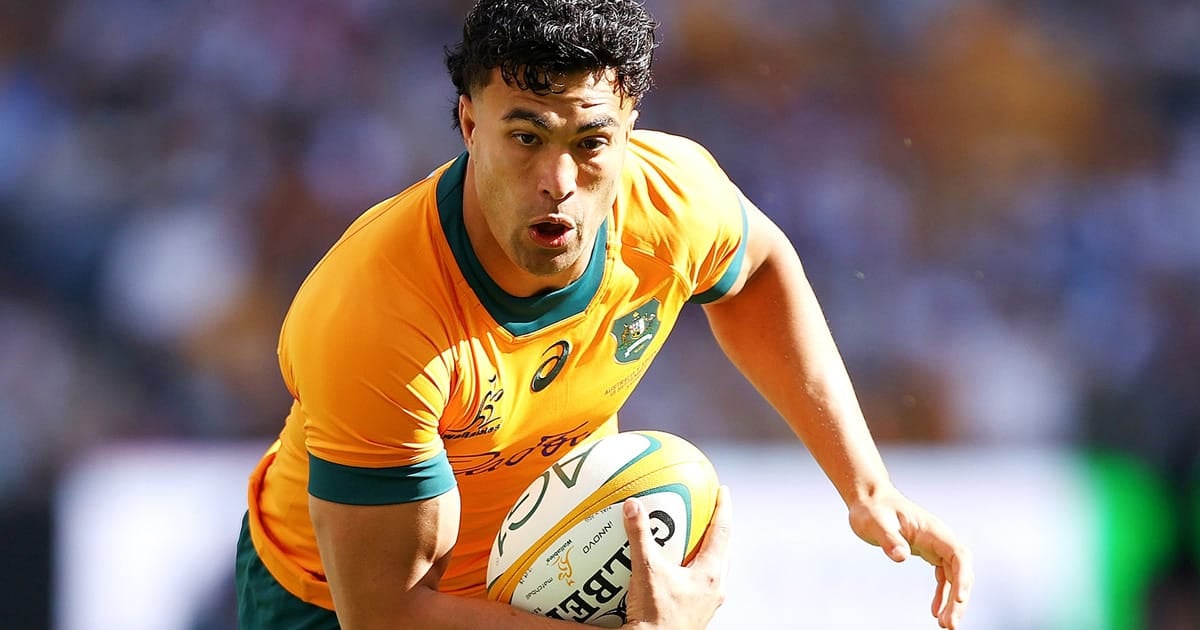 Wallabies player ratings: a Wallabies back in the gold jersey runs with the ball in both hands