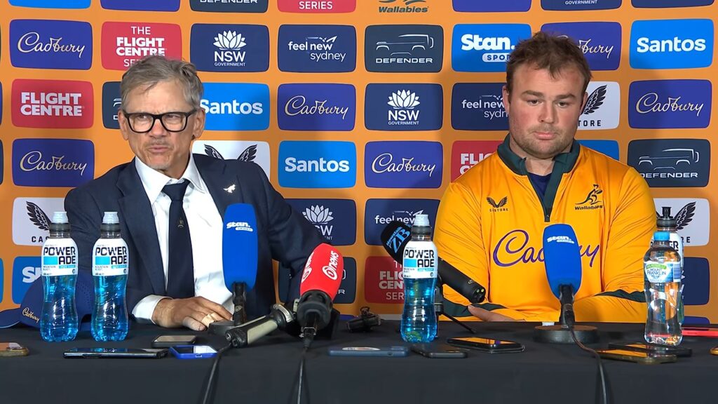 Les Kiss, Wallabies head coach, talking about fly-half Declan Meredith at the post-match press conference in Sydney, with captain Harry Wilson beside him
