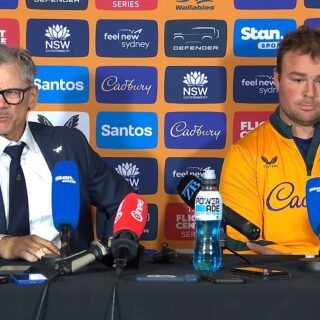 Les Kiss, Wallabies head coach, talking about fly-half Declan Meredith at the post-match press conference in Sydney, with captain Harry Wilson beside him