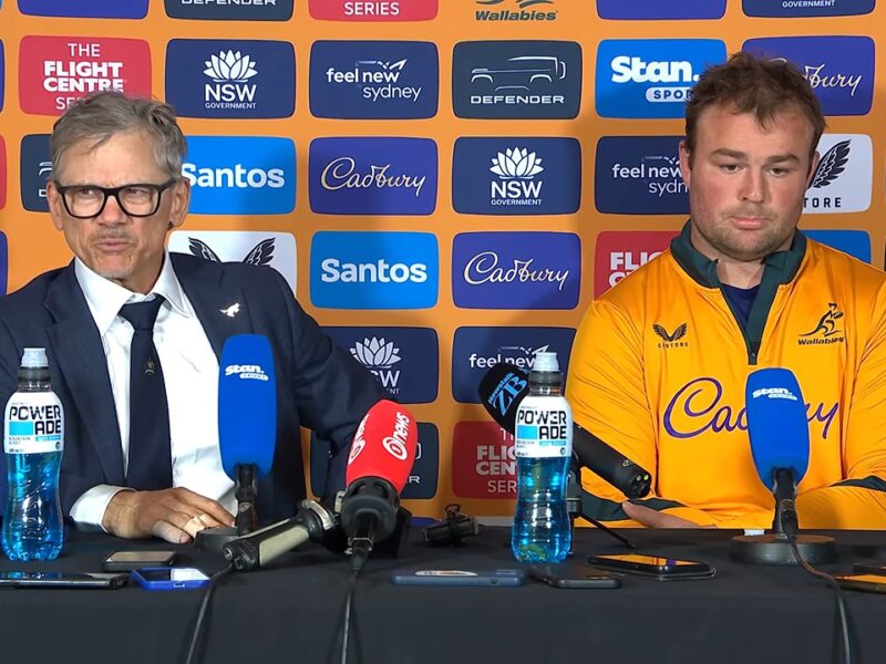 Les Kiss, Wallabies head coach, talking about fly-half Declan Meredith at the post-match press conference in Sydney, with captain Harry Wilson beside him