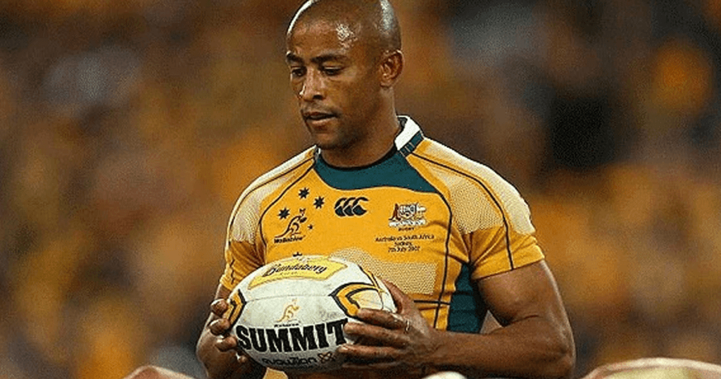 George Gregan holding the ball in a Wallabies jersey