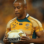 George Gregan holding the ball in a Wallabies jersey