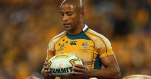 George Gregan holding the ball in a Wallabies jersey