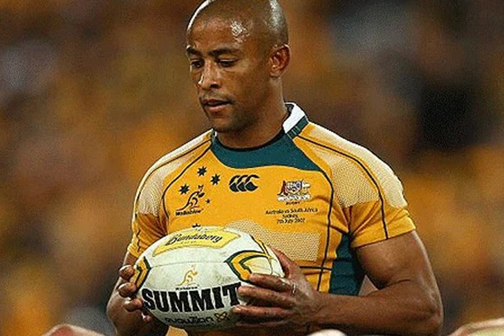 George Gregan holding the ball in a Wallabies jersey
