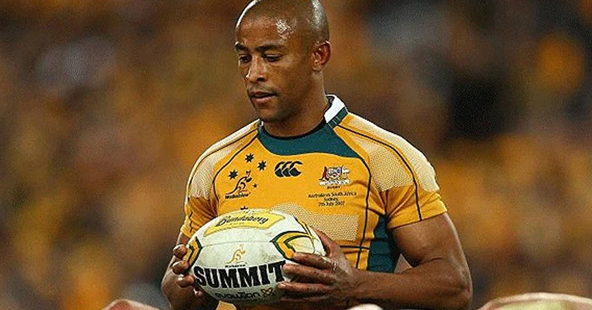 George Gregan holding the ball in a Wallabies jersey