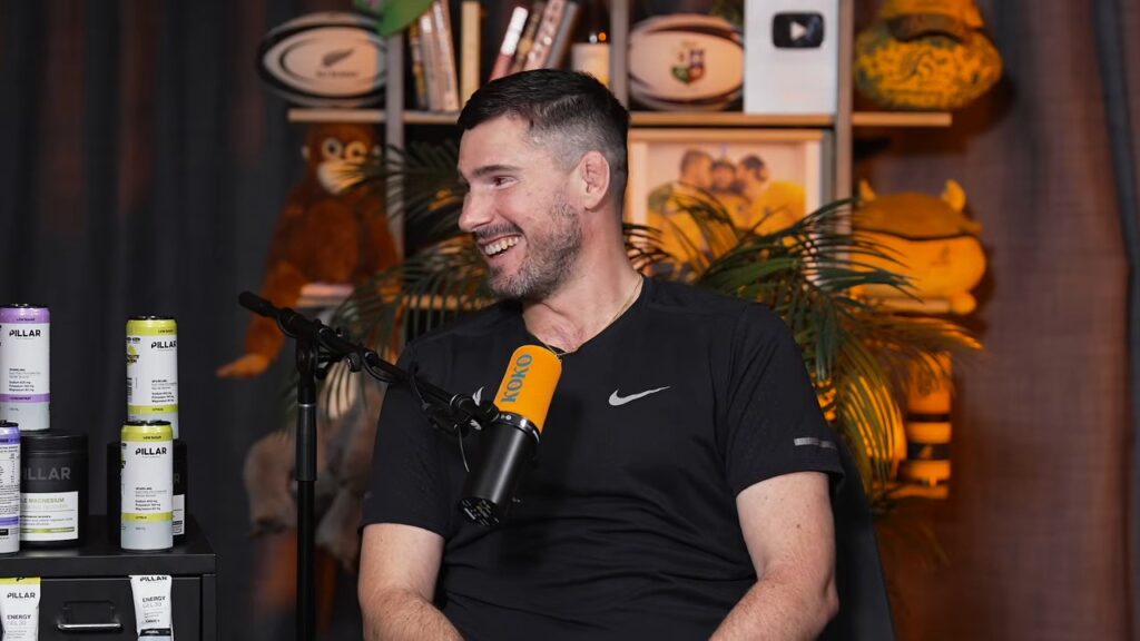 Nathan Charles, former Wallabies hooker, smiles on the Kick Offs and Kick Ons couch while talking about his foundation and life with MND