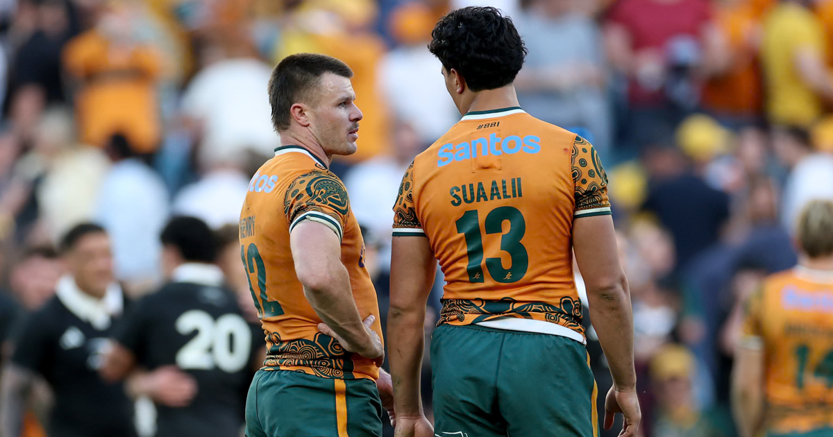 Wallabies player ratings vs All Blacks: Joseph-Aukuso Suaalii in the gold 13 shirt stands beside the Wallabies 12, with an All Black behind them